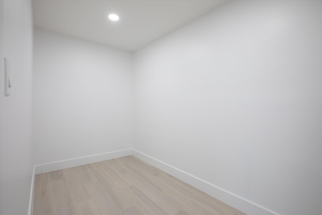 unfurnished room featuring light wood-style flooring, recessed lighting, and baseboards