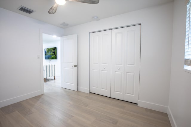 unfurnished bedroom featuring visible vents, baseboards, and light wood-style floors