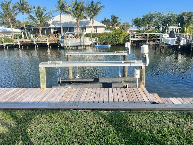 view of dock with a water view and boat lift