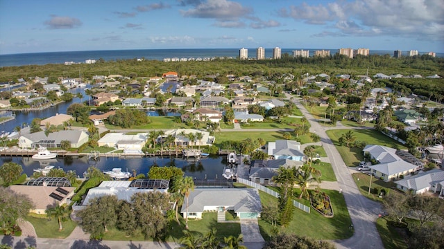 bird's eye view with a water view and a residential view