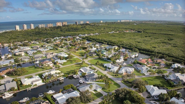 bird's eye view featuring a residential view and a water view