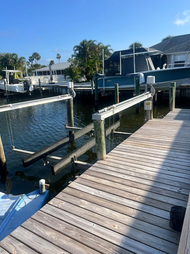 dock area featuring a water view and boat lift