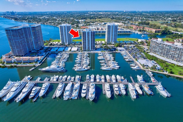 birds eye view of property with a water view and a view of city