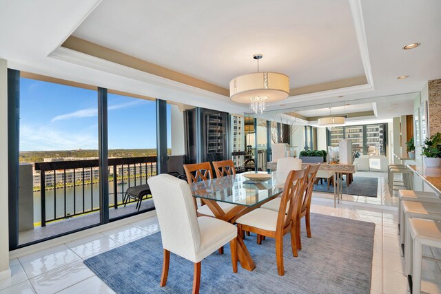 108 Lakeshore Dr Unit 1441, North Palm Beach, FL 33408 - dining room with a tray ceiling, a chandelier, light tile patterned floors, baseboards, and recessed lighting