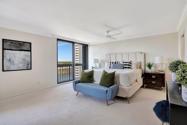 bedroom with crown molding, baseboards, ceiling fan, floor to ceiling windows, and light colored carpet