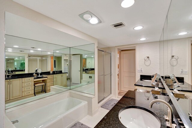108 Lakeshore Dr Unit 1441, North Palm Beach, FL 33408 - bathroom featuring a shower stall, tile patterned flooring, double vanity, a bath, and recessed lighting