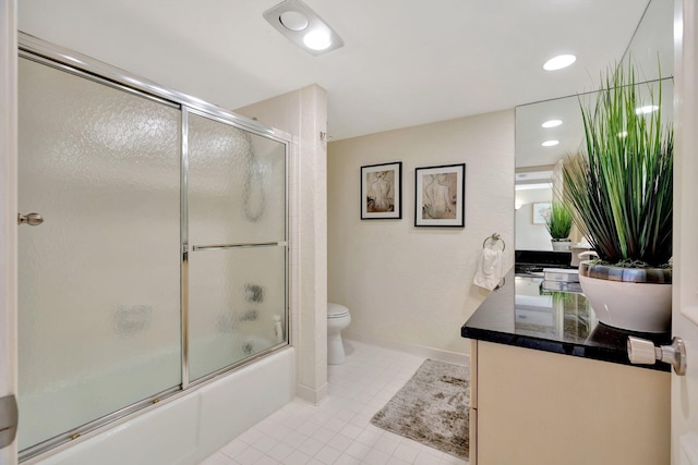 full bathroom with tile patterned floors, toilet, shower / bath combination with glass door, baseboards, and vanity