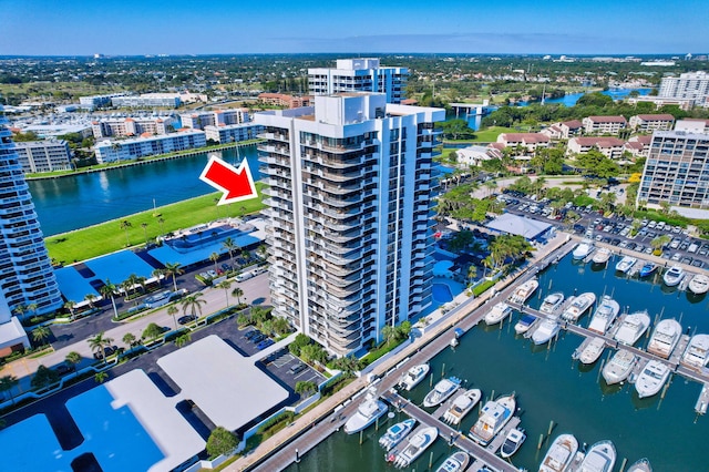 birds eye view of property featuring a water view and a view of city