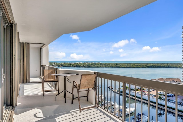 balcony featuring a water view