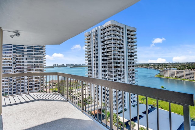 balcony featuring a view of city and a water view