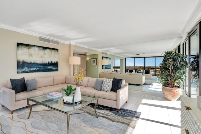 tiled living area featuring visible vents, a wall of windows, and crown molding