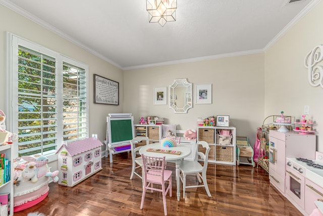 recreation room featuring wood finished floors and crown molding