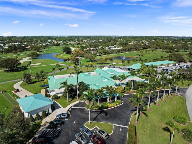 aerial view with view of golf course and a water view