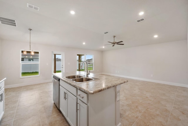 kitchen featuring visible vents, stainless steel dishwasher, a ceiling fan, and a sink