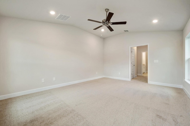 unfurnished room featuring visible vents, a ceiling fan, and vaulted ceiling