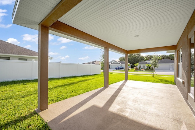 view of patio / terrace featuring a residential view and fence