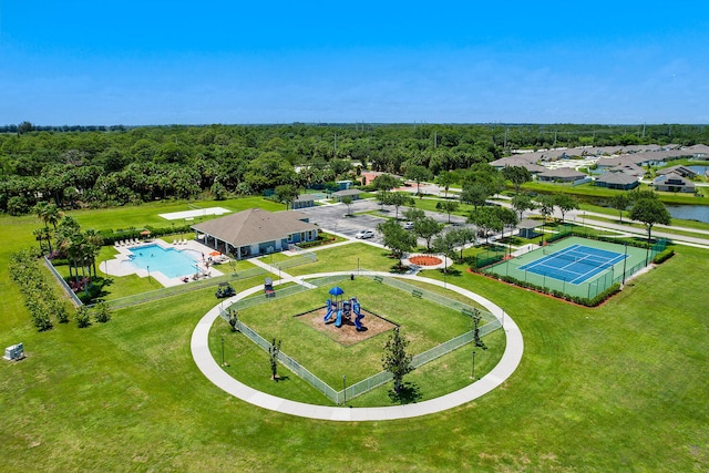 drone / aerial view with a wooded view