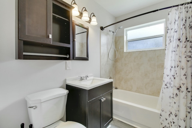 full bathroom featuring toilet, shower / bath combo, and vanity