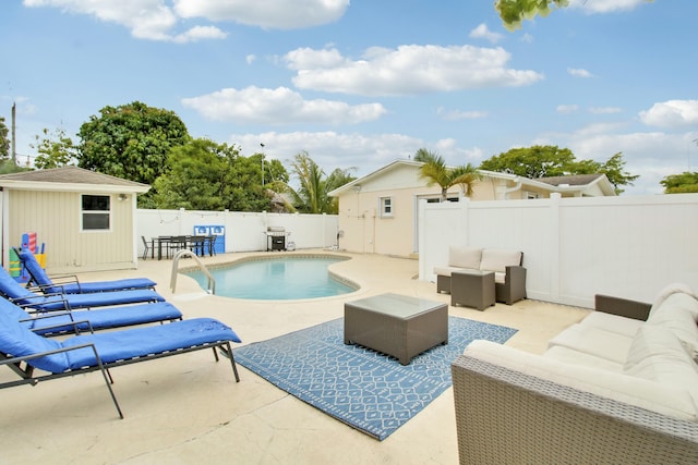 view of swimming pool featuring a patio area, an outdoor hangout area, and an outdoor structure