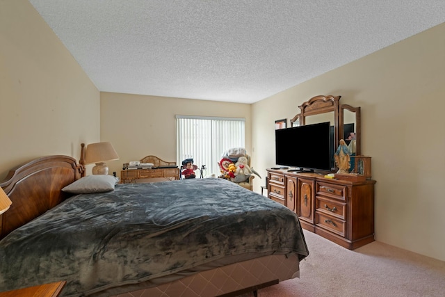 carpeted bedroom featuring a textured ceiling