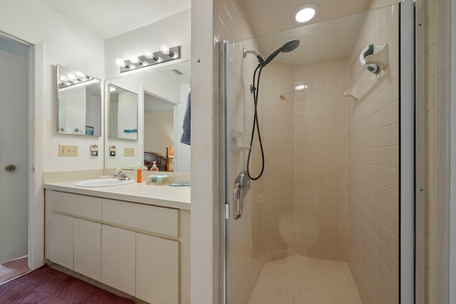 full bath with vanity and a stall shower