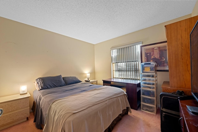 bedroom featuring a textured ceiling and carpet