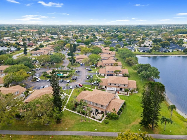 birds eye view of property featuring a residential view and a water view