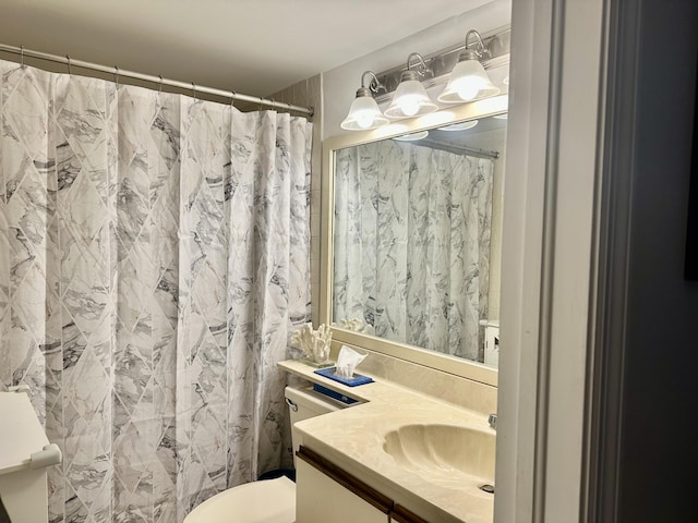 full bath with a shower with shower curtain, toilet, and vanity