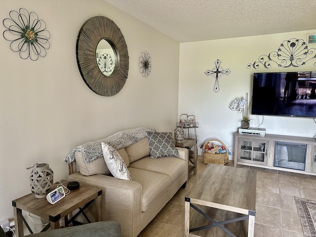 tiled living room with a textured ceiling