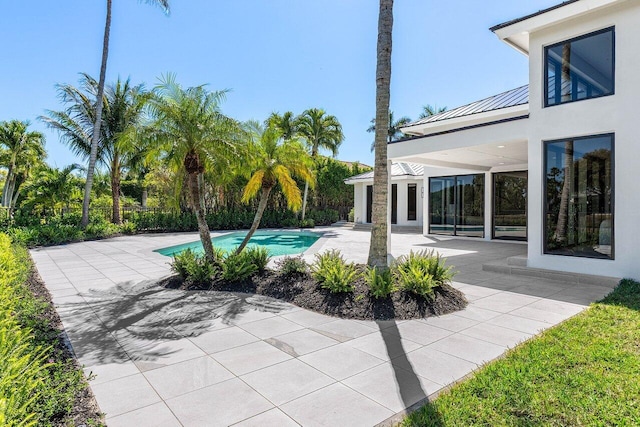 pool with a patio