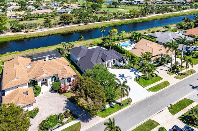 bird's eye view featuring a residential view and a water view