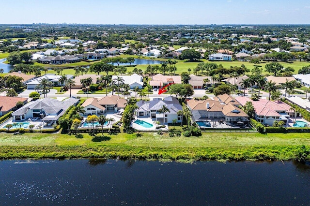 birds eye view of property featuring a residential view and a water view