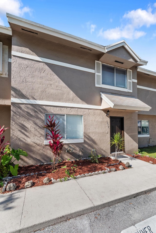 townhome / multi-family property with stucco siding