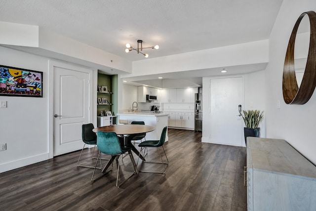 dining room with an inviting chandelier, dark wood-type flooring, and baseboards