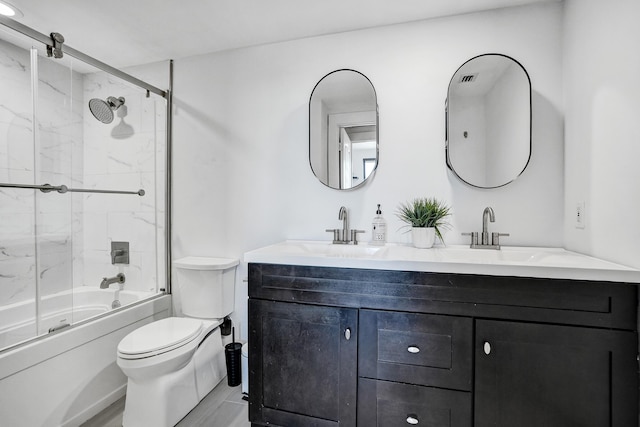 full bath featuring double vanity, toilet, shower / bath combination with glass door, and a sink