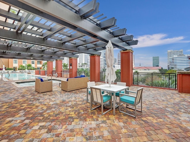 view of patio featuring a pergola, fence, a community pool, outdoor dining area, and a hot tub