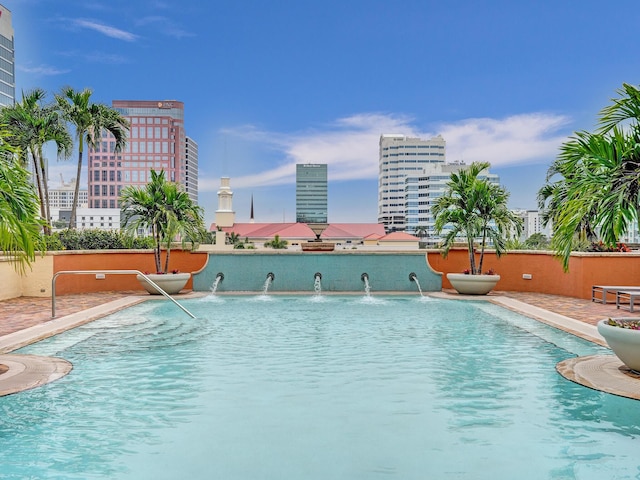 community pool featuring a city view