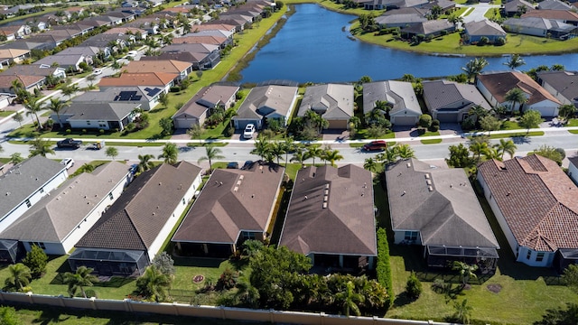 birds eye view of property featuring a residential view and a water view