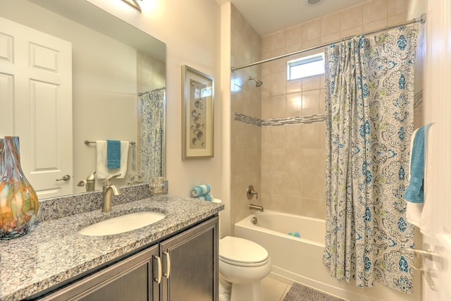 bathroom featuring toilet, vanity, and shower / bath combo