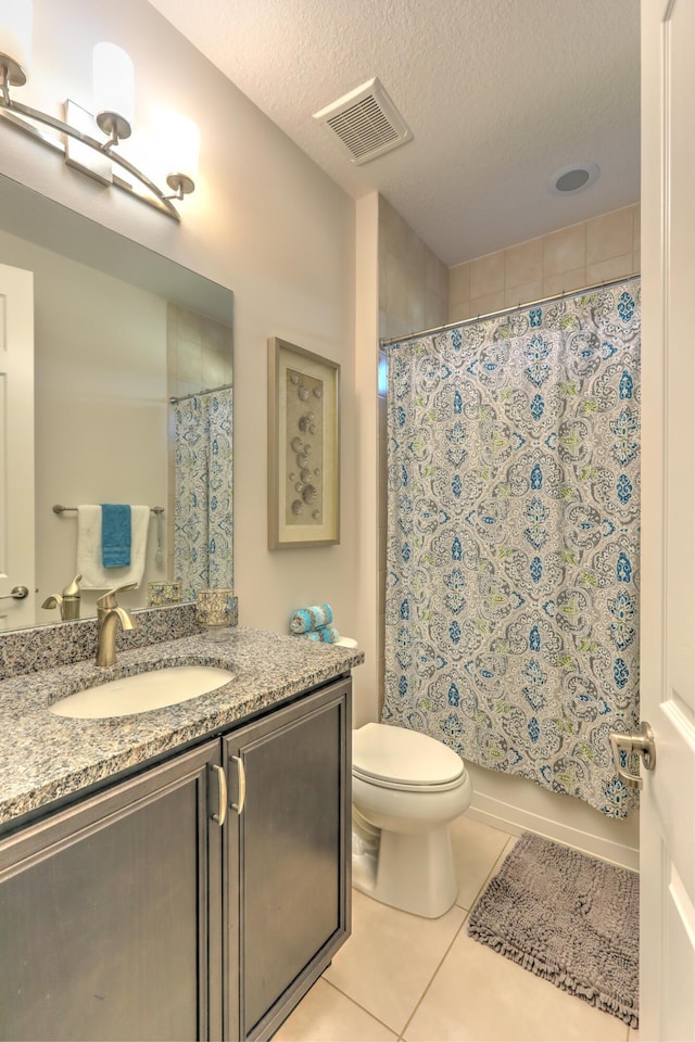 bathroom featuring tile patterned floors, visible vents, toilet, shower / bath combo, and a textured ceiling