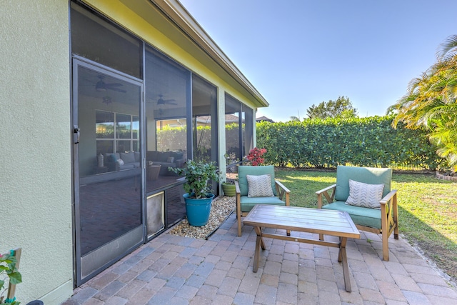 view of patio / terrace with a sunroom