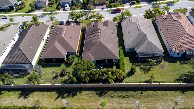 birds eye view of property with a residential view