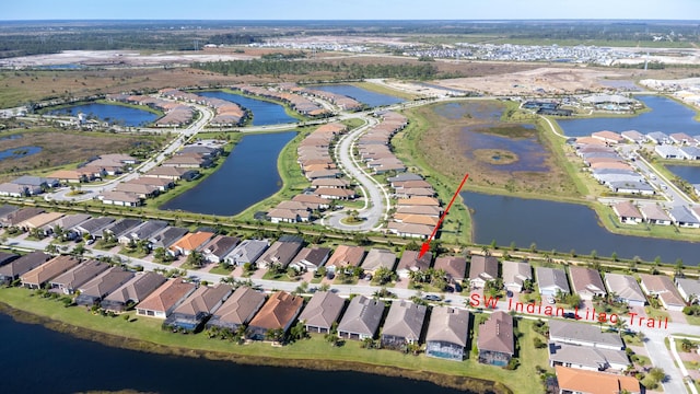 aerial view with a residential view and a water view