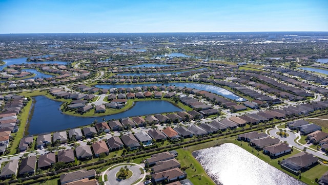 aerial view with a residential view and a water view