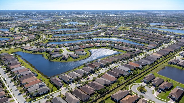 aerial view with a residential view and a water view