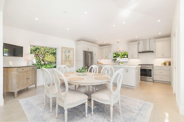 dining space featuring light tile patterned flooring, recessed lighting, and a healthy amount of sunlight