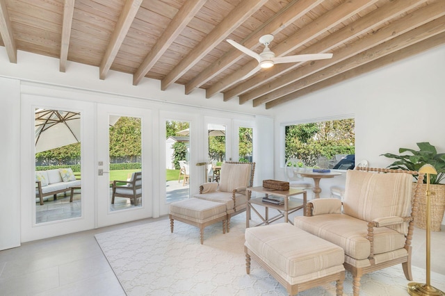 sunroom / solarium with lofted ceiling with beams, french doors, wooden ceiling, and a ceiling fan