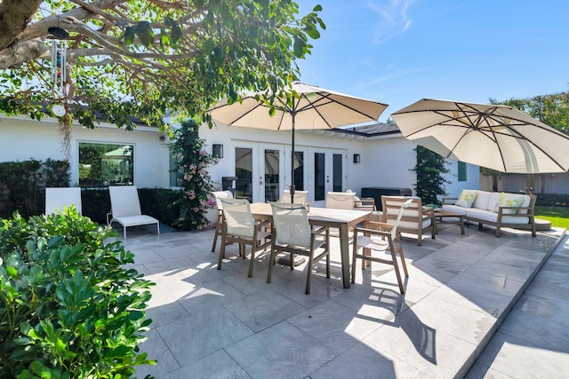 view of patio with outdoor dining space, french doors, and an outdoor hangout area