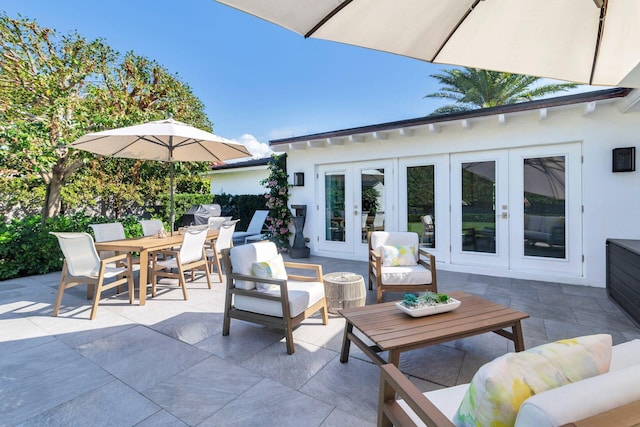 view of patio featuring outdoor lounge area, outdoor dining area, and french doors