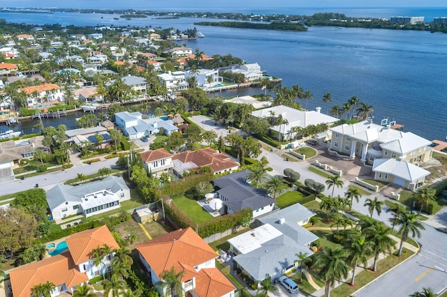 aerial view featuring a residential view and a water view